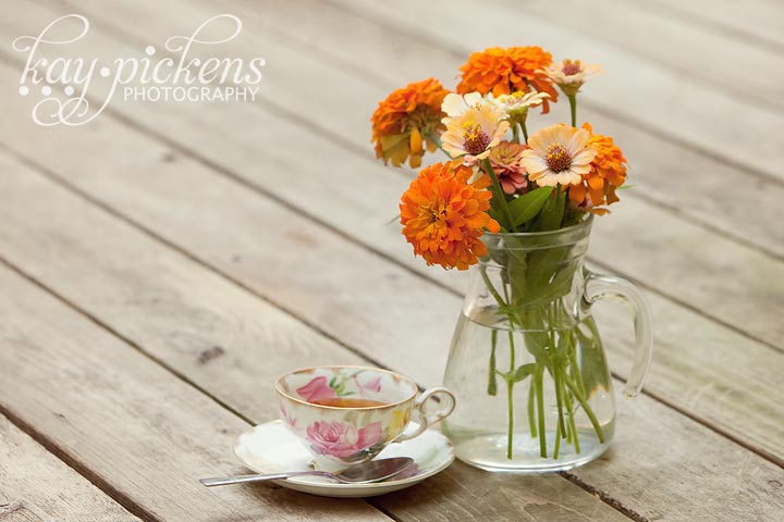 tea and flowers with antique teacup