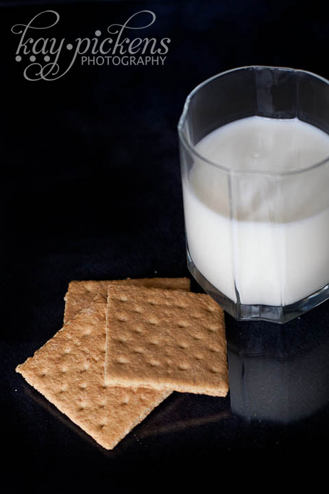 Milk and graham crackers on black